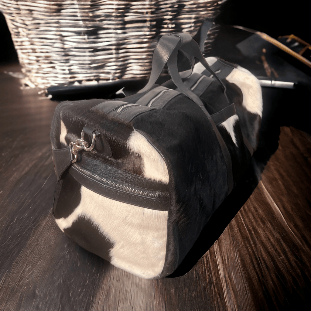 Cowhide Duffle Bag - Black and White Cowhide and Conchos