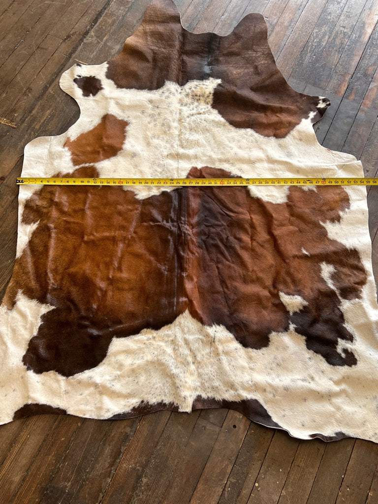 Cowhide Rug - 6.5 ft by 4.5 ft. Cowhide and Conchos