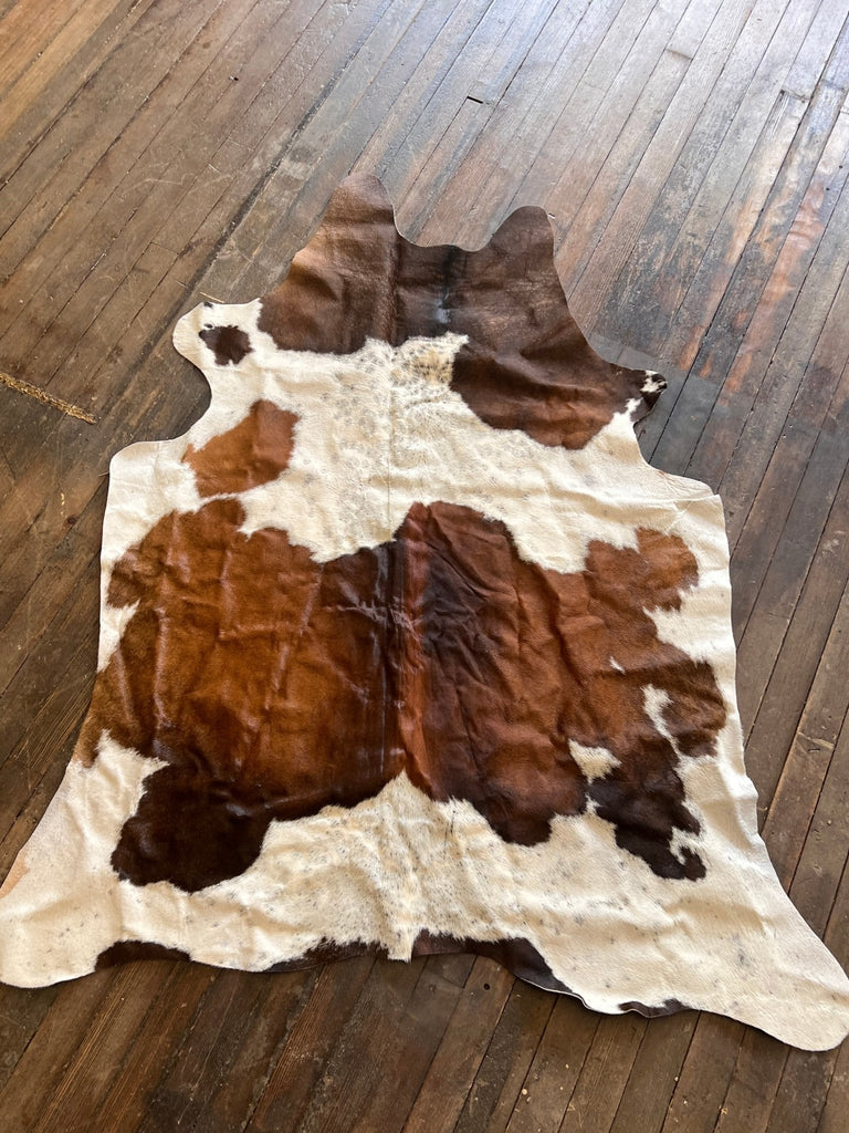 Cowhide Rug - 6.5 ft by 4.5 ft. Cowhide and Conchos