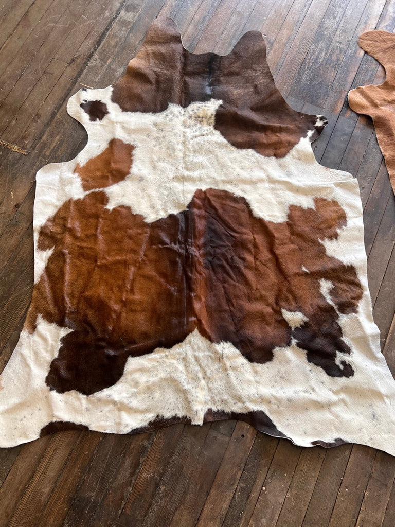 Cowhide Rug - 6.5 ft by 4.5 ft. Cowhide and Conchos